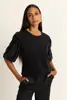 Top met paillettenmouwen