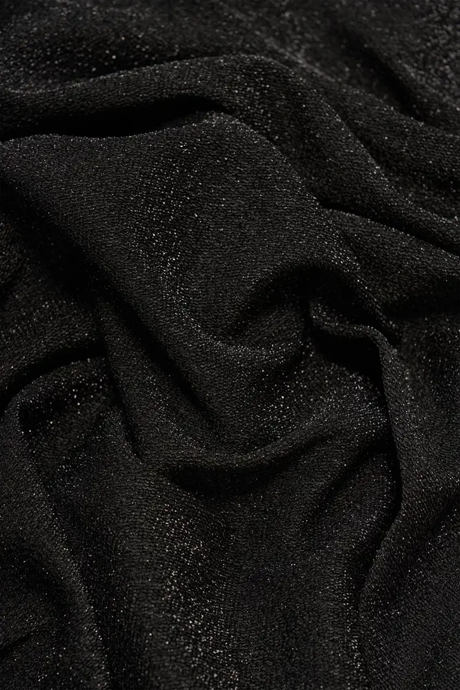 Glitterjurk met knoopdetail