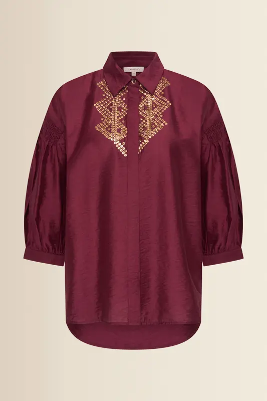 Blouse met goudkleurige borduursels